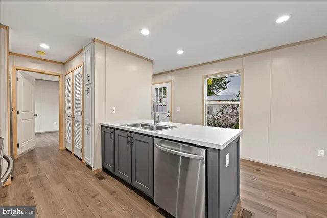 a kitchen with a sink and a refrigerator
