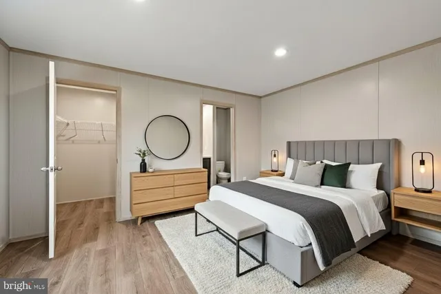 a bedroom with a bed and a dresser