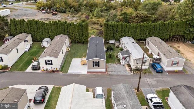 a front view of a house with a garden and sitting area