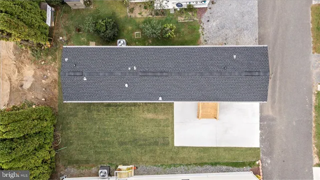 an aerial view of a house with outdoor space