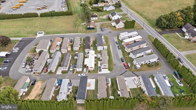 an aerial view of a residential apartment building with a yard