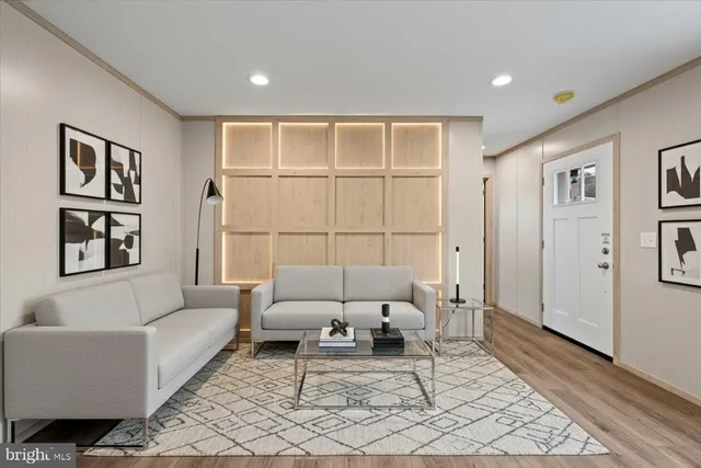a living room with furniture and a rug