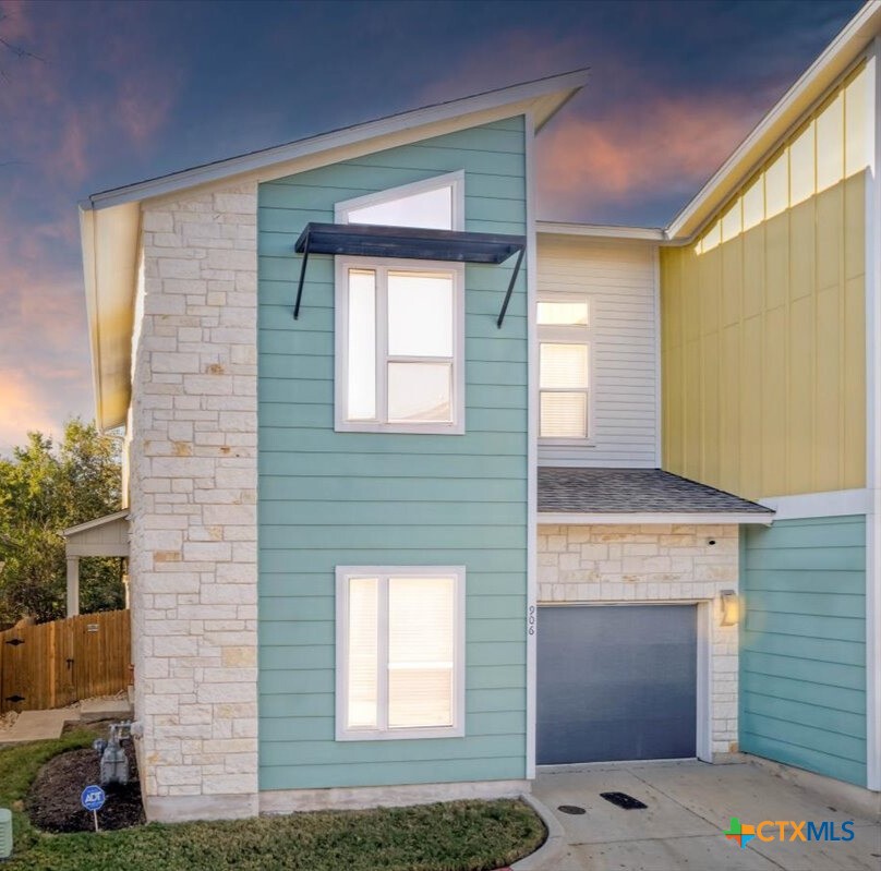 8922 Manchaca Road, Unit 906 Austin, TX 78748 - Photo 12 of 16 a front view of a house with a yard