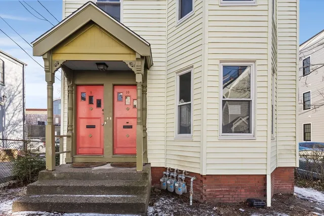 a view of a house with a door and balcony