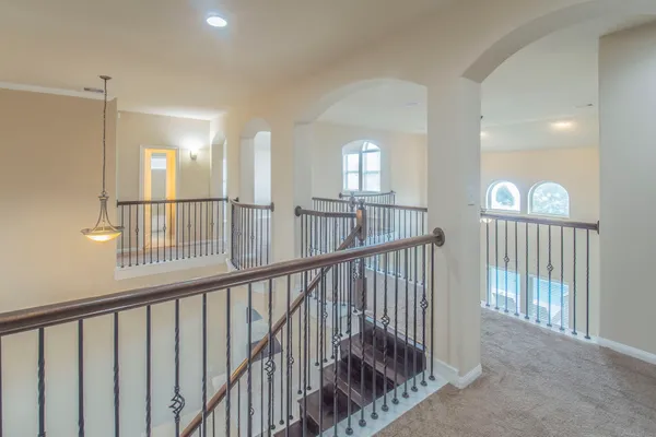 a view of a hallway with windows