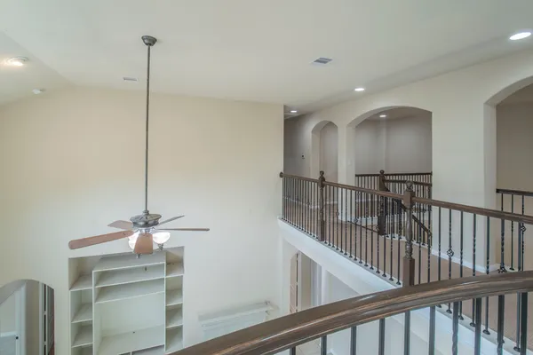 a view of a hallway with windows