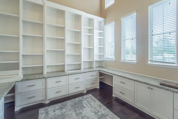 a room with cabinets and window