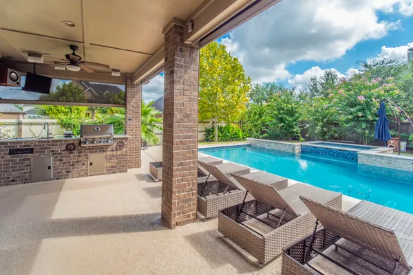 a view of swimming pool with a patio