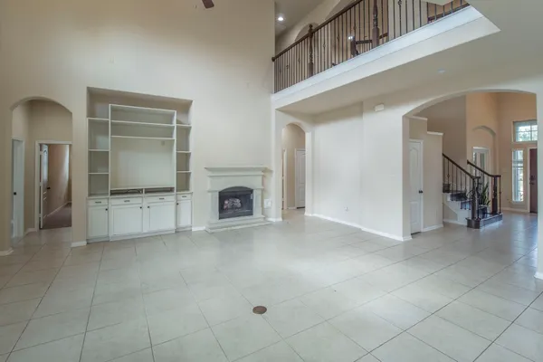 a view of a livingroom with an empty space and a fireplace