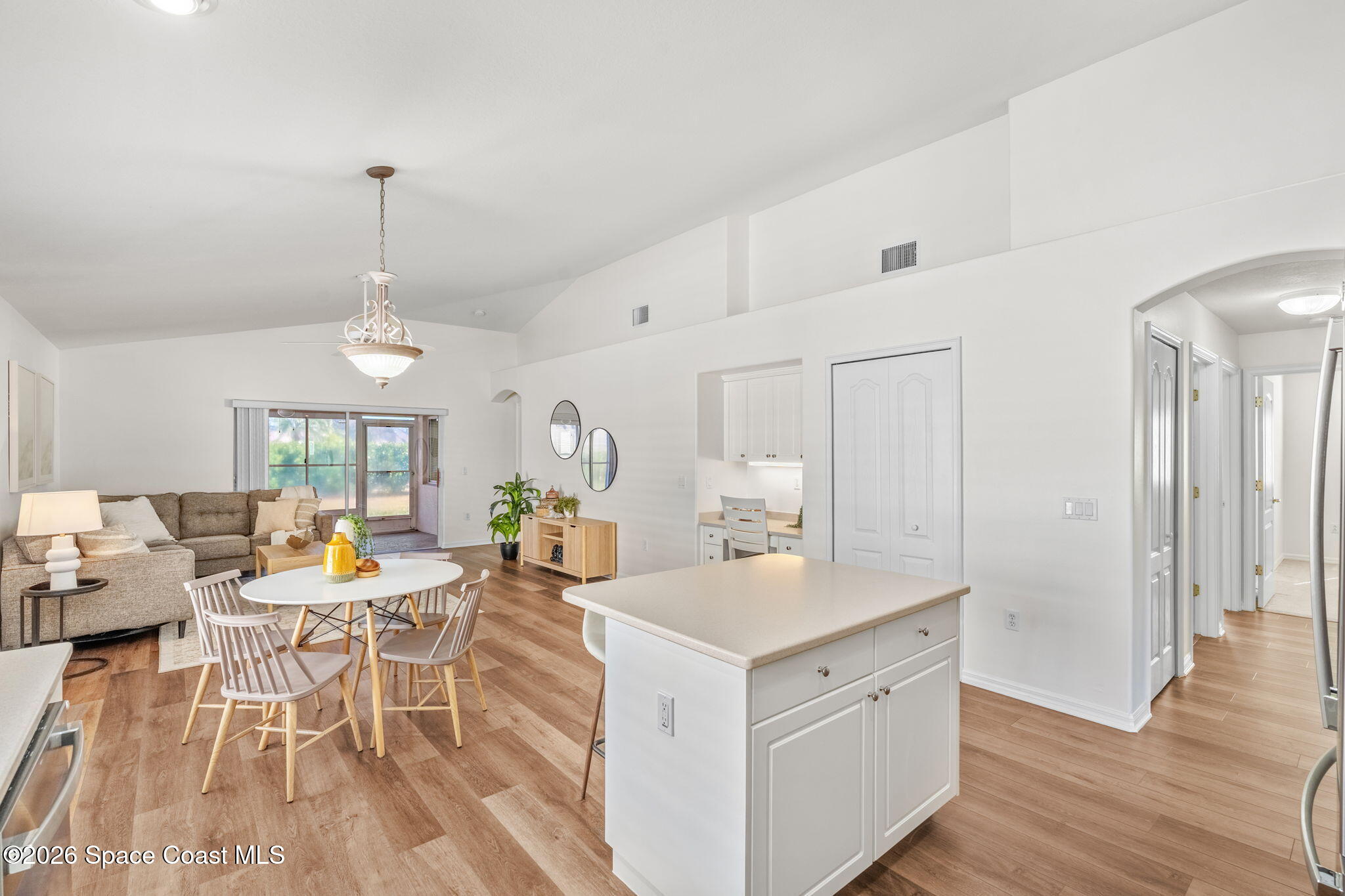 1634 Timacuan Drive Melbourne, FL 32940 - Photo 15 of 77 a view of a dining room with furniture window and wooden floor