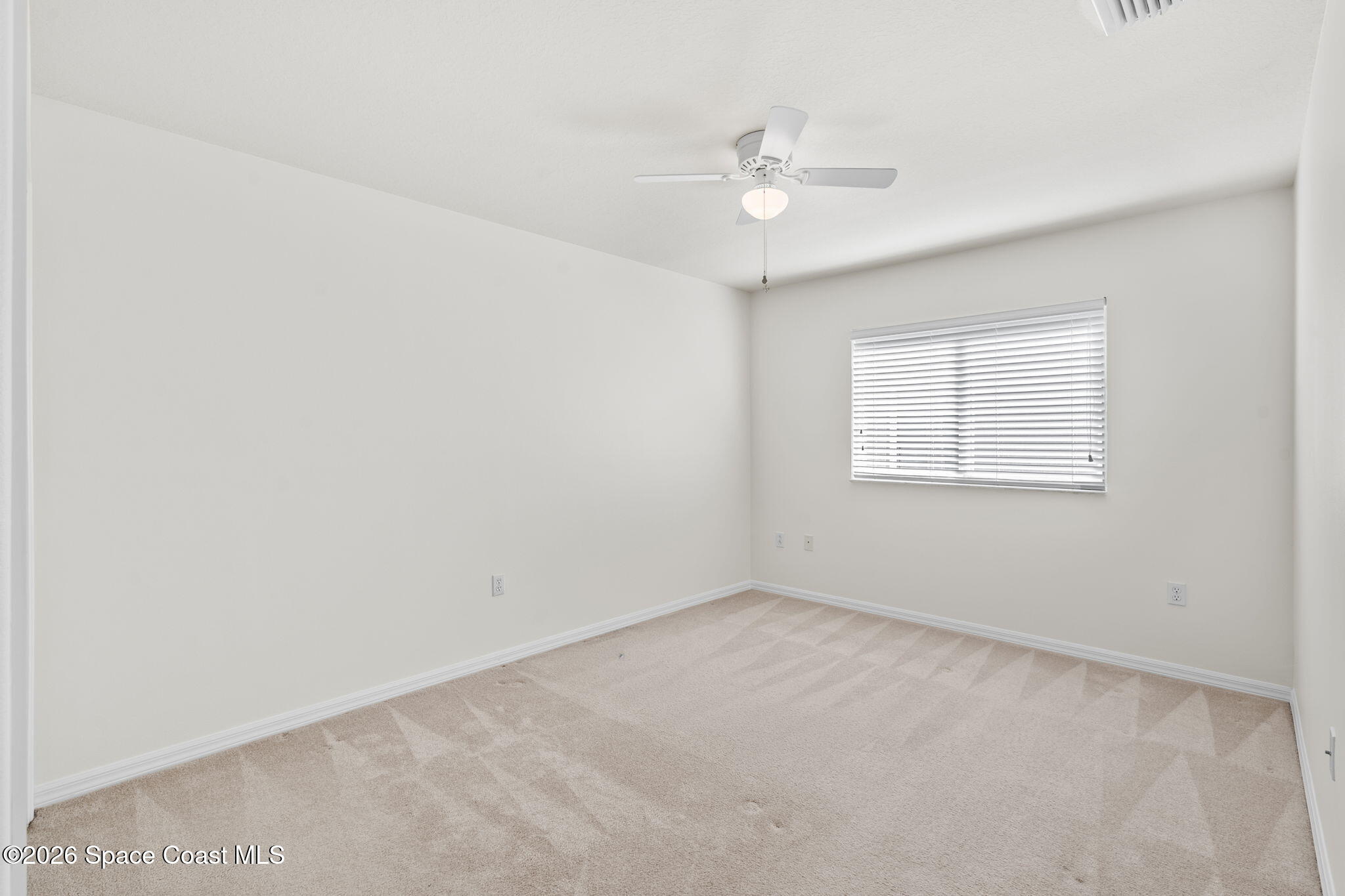 1634 Timacuan Drive Melbourne, FL 32940 - Photo 19 of 77 a view of an empty room with a window