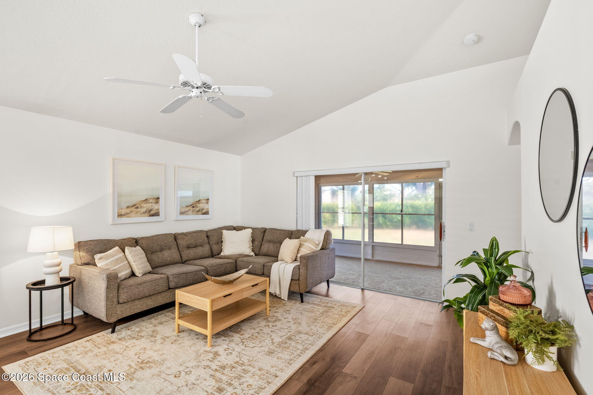 1634 Timacuan Drive Melbourne, FL 32940 - Photo 24 of 77 a living room with furniture and a potted plant