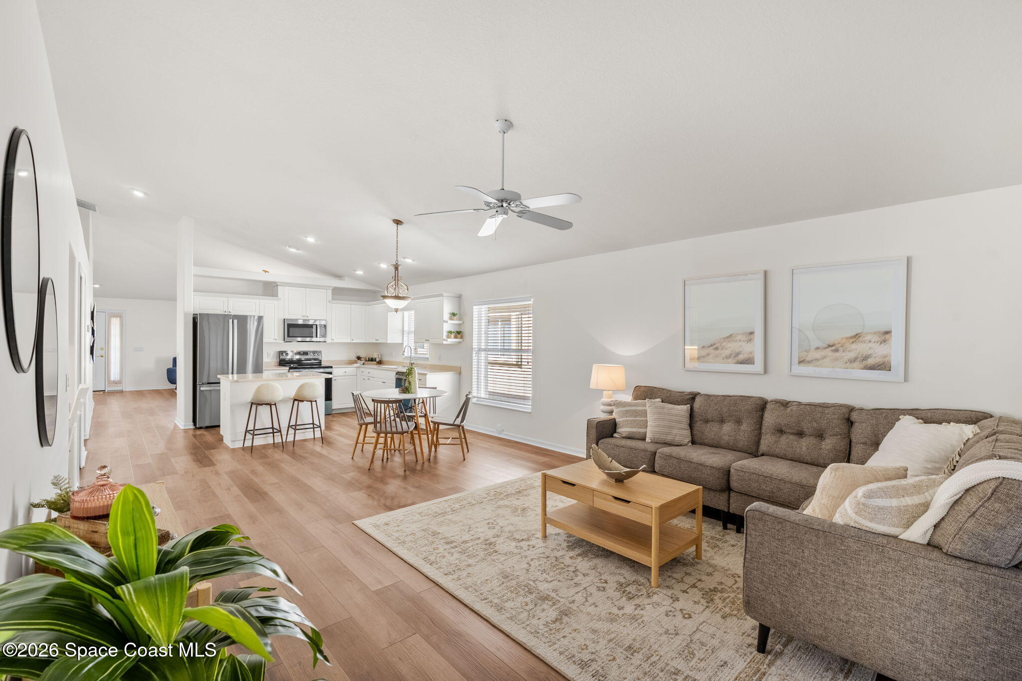 1634 Timacuan Drive Melbourne, FL 32940 - Photo 26 of 77 a living room with furniture kitchen and a table
