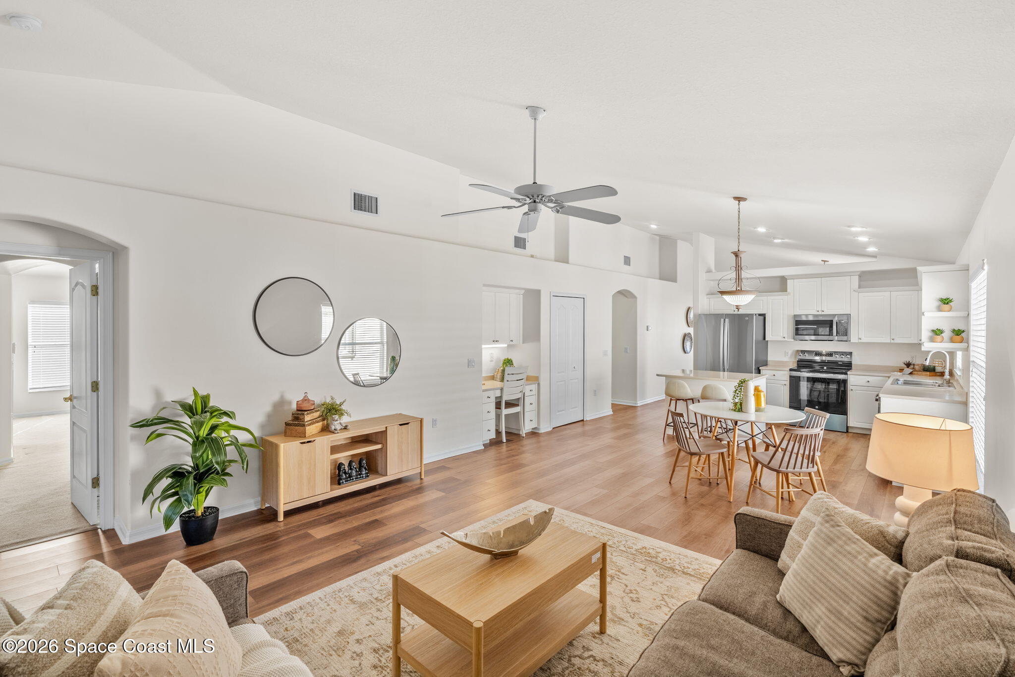 1634 Timacuan Drive Melbourne, FL 32940 - Photo 27 of 77 a living room with furniture kitchen view and a table