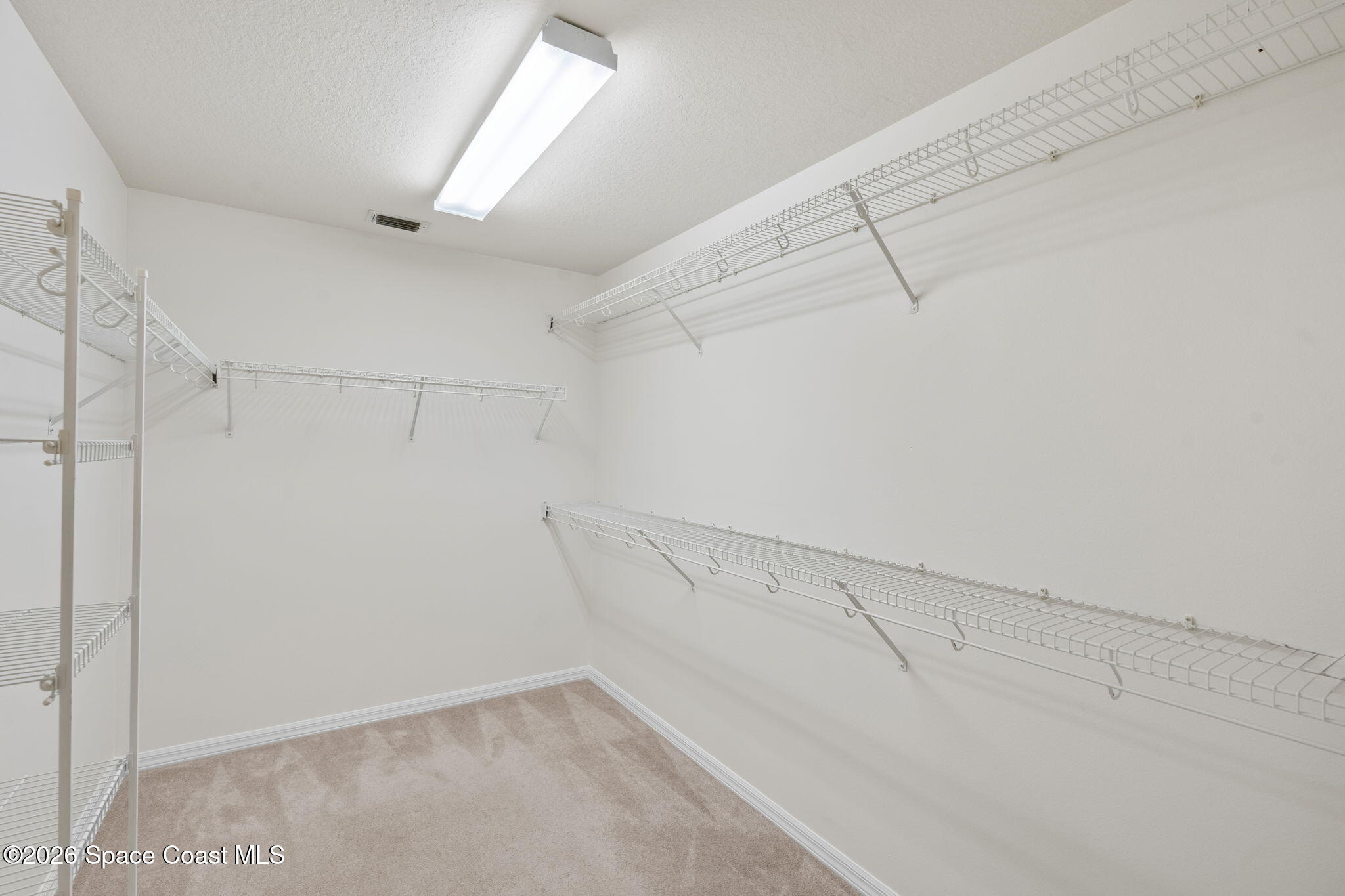 1634 Timacuan Drive Melbourne, FL 32940 - Photo 34 of 77 a view of a room with racks on the wall