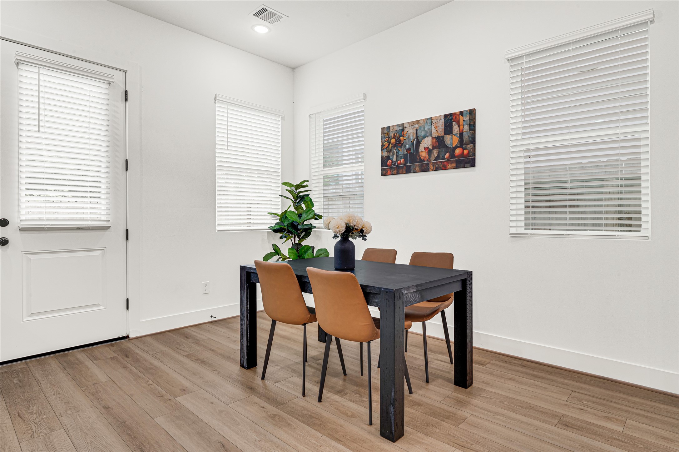 4201 Stassen Street Houston, TX 77051 - Photo 16 of 39 a view of a dining room with furniture and wooden floor