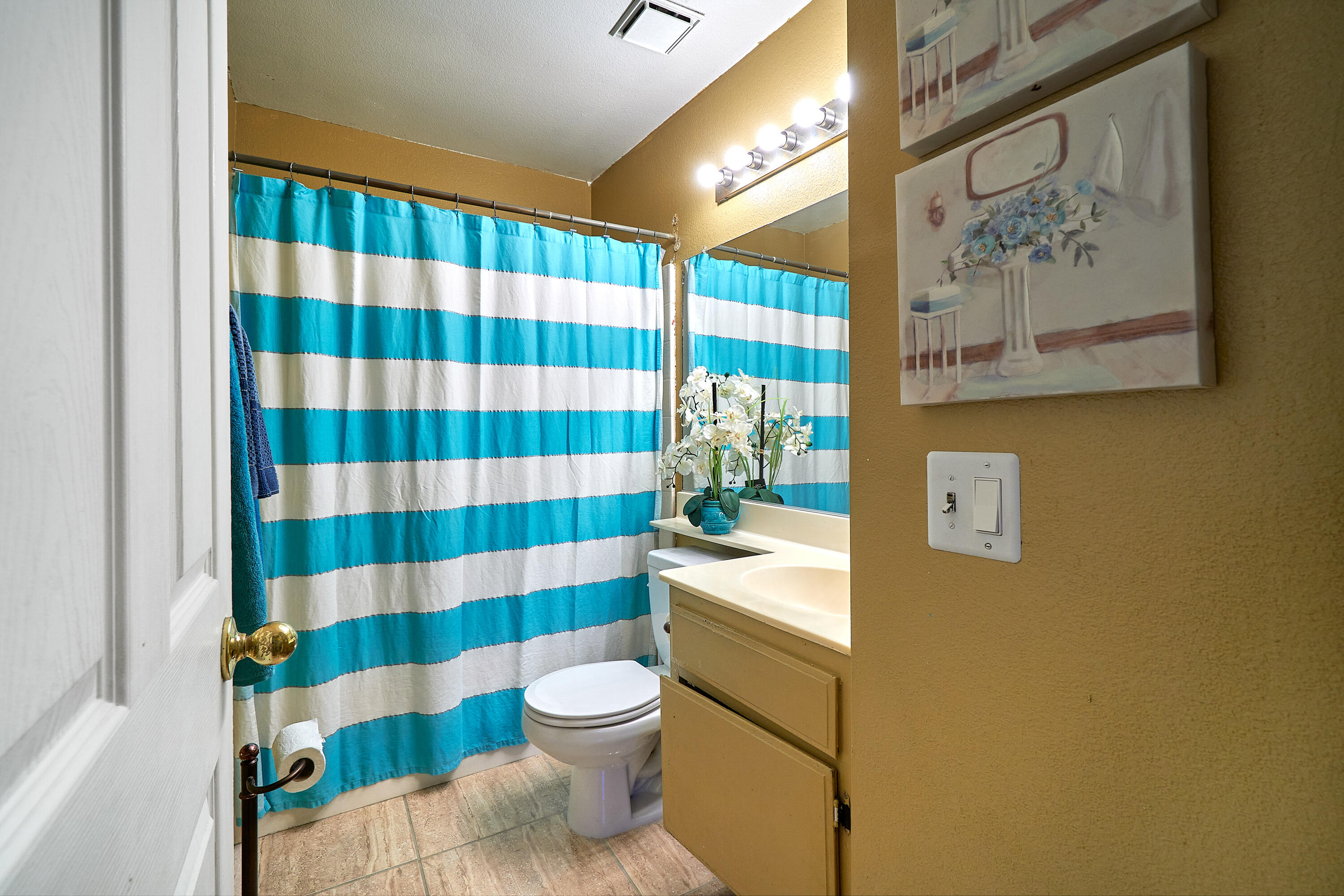 44146 Cassia Drive Indio, CA 92201 - Photo 18 of 20 a bathroom with a sink toilet and shower