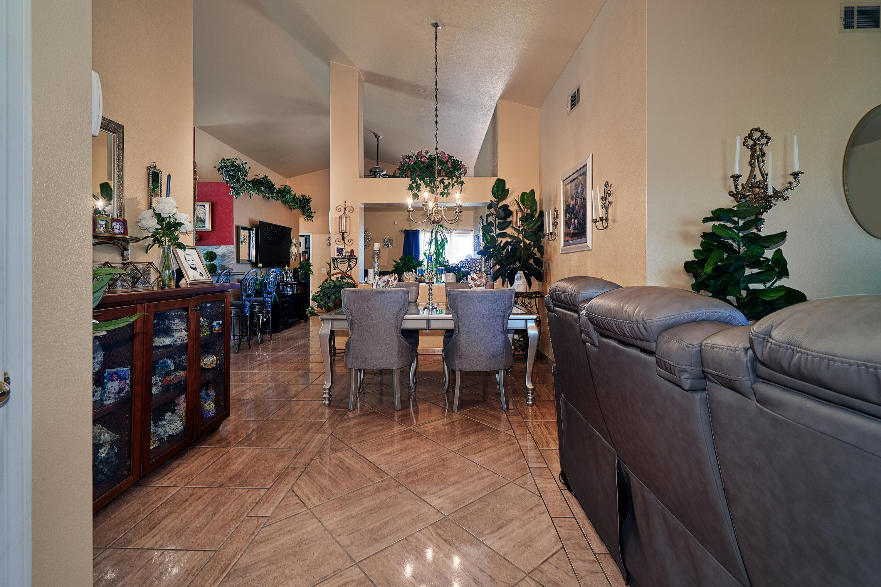 44146 Cassia Drive Indio, CA 92201 - Photo 4 of 20 a living room with furniture a dining table and a potted plant