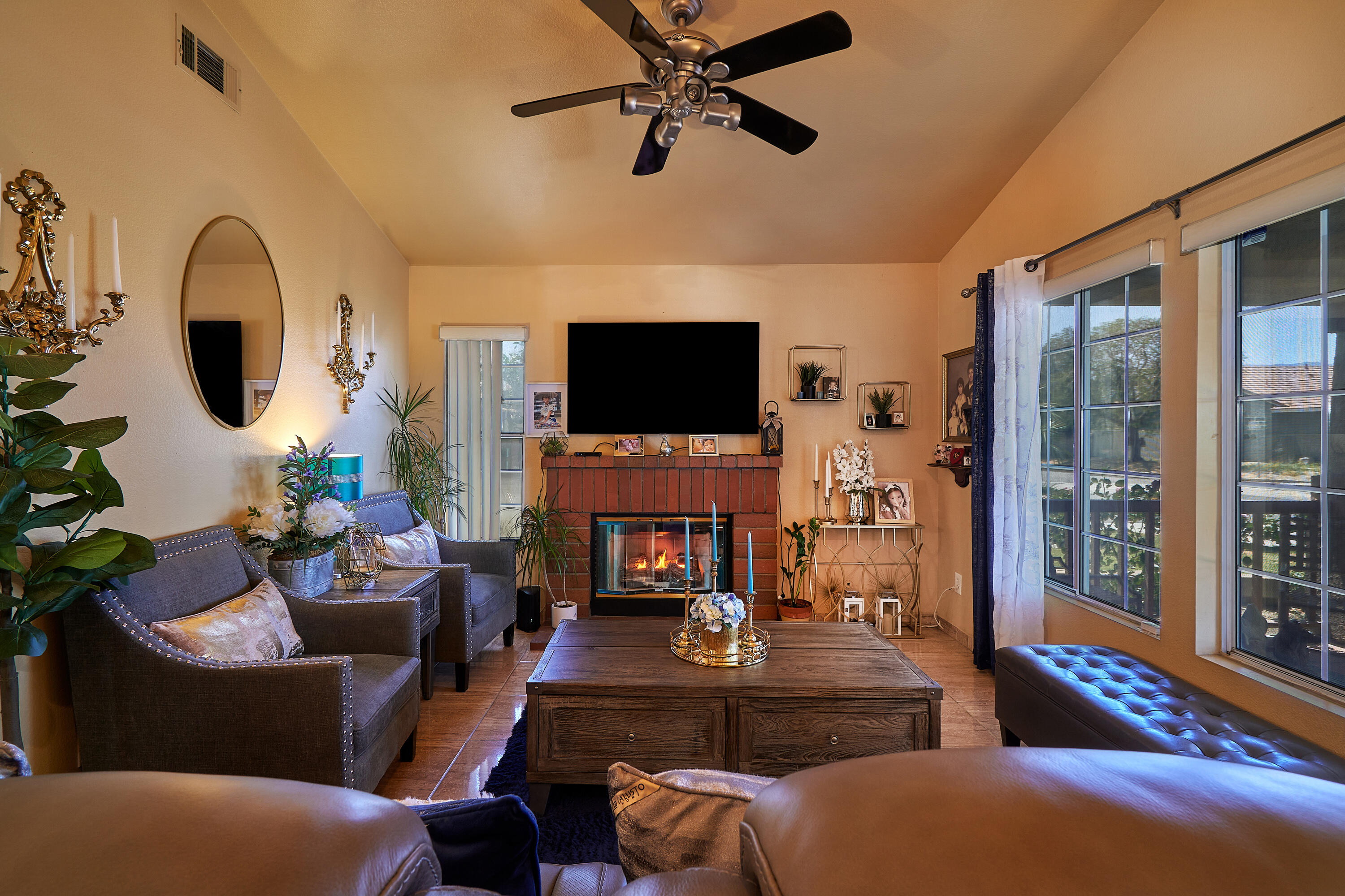 44146 Cassia Drive Indio, CA 92201 - Photo 5 of 20 a living room with furniture a flat screen tv and a fireplace
