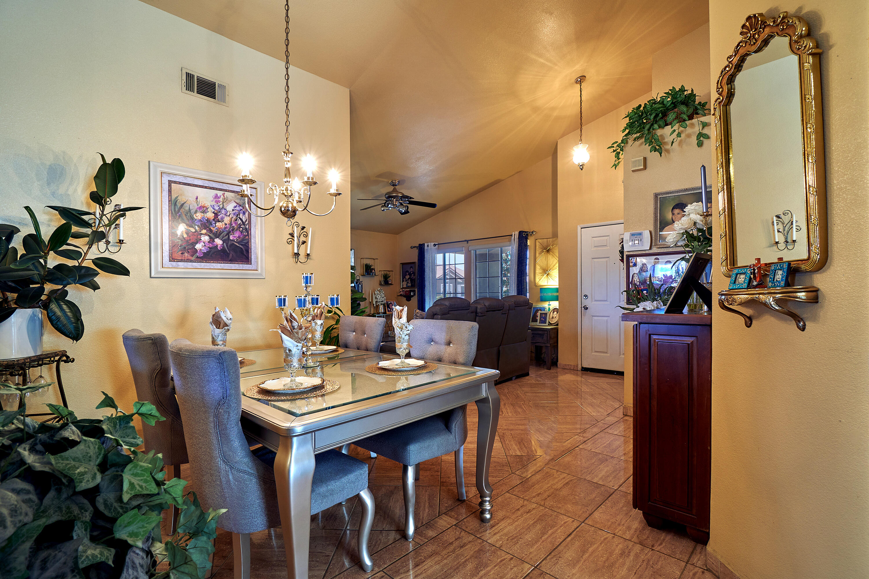 44146 Cassia Drive Indio, CA 92201 - Photo 7 of 20 a view of a dining room with furniture and a chandelier
