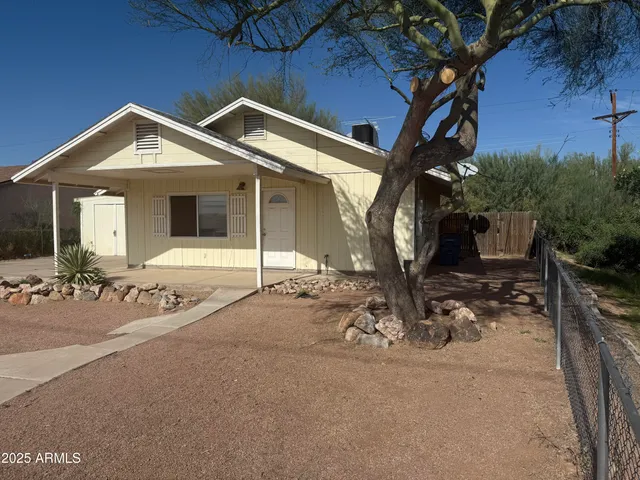 a view of a house with outdoor space and porch