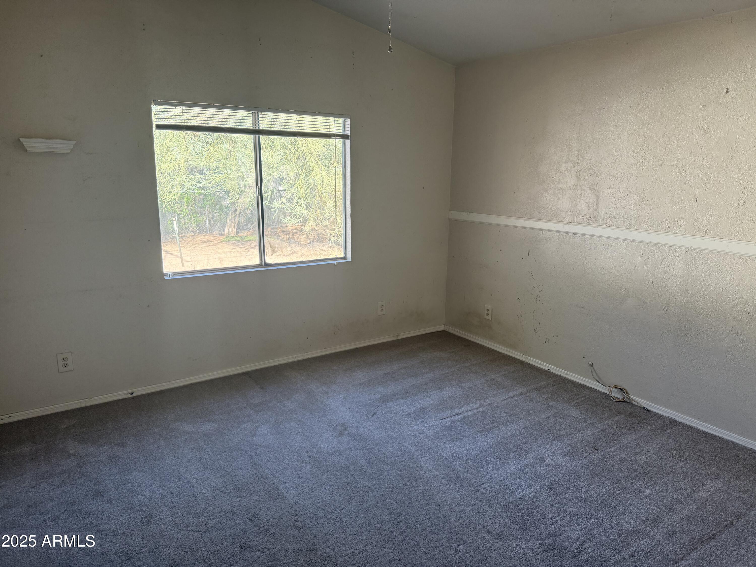 11020 East University Drive Apache Junction, AZ 85120 - Photo 6 of 9 an empty room with a window