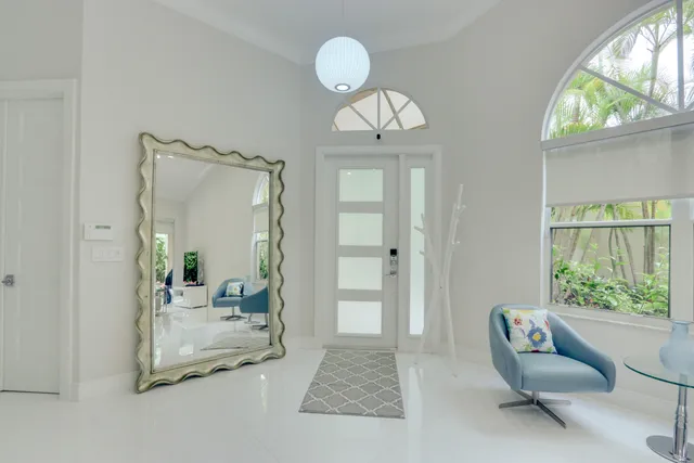 a view of a livingroom with furniture and windows