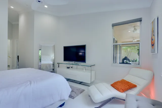 a bathroom with a tub sink and mirror