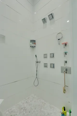 a bathroom with a toilet a sink and mirror