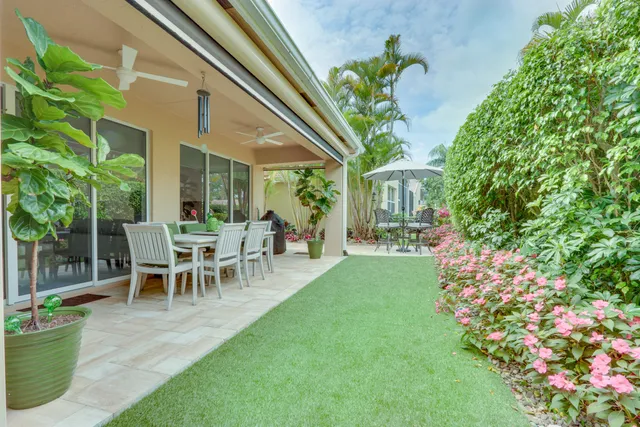 a very nice looking dining room with furniture and chandelier