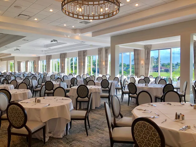 a very nice looking dining room with furniture window and outside view