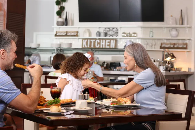 a view of a swimming pool with a table and chairs