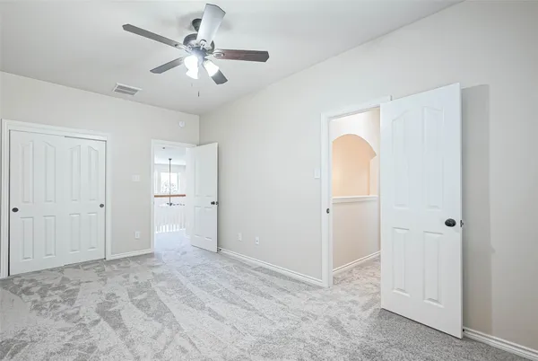 a spacious bathroom with a shower sink and mirror