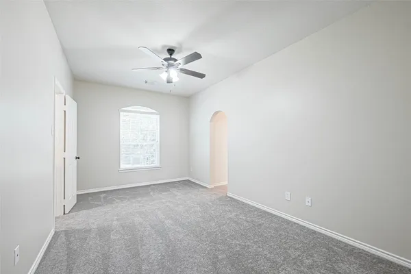 a bathroom with a tub sink shower and mirror