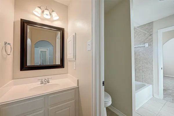 a bathroom with a sink a mirror and a shower