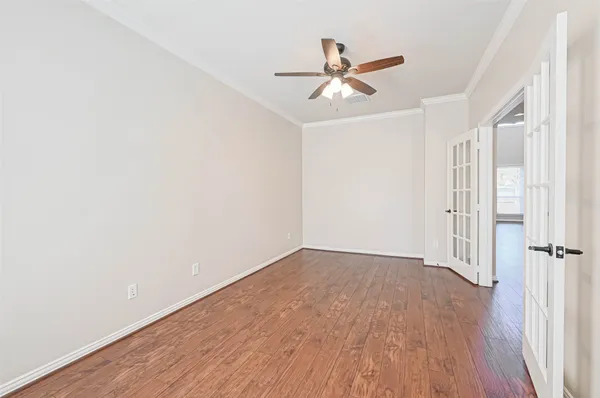 a view of an empty room with a fireplace and a window