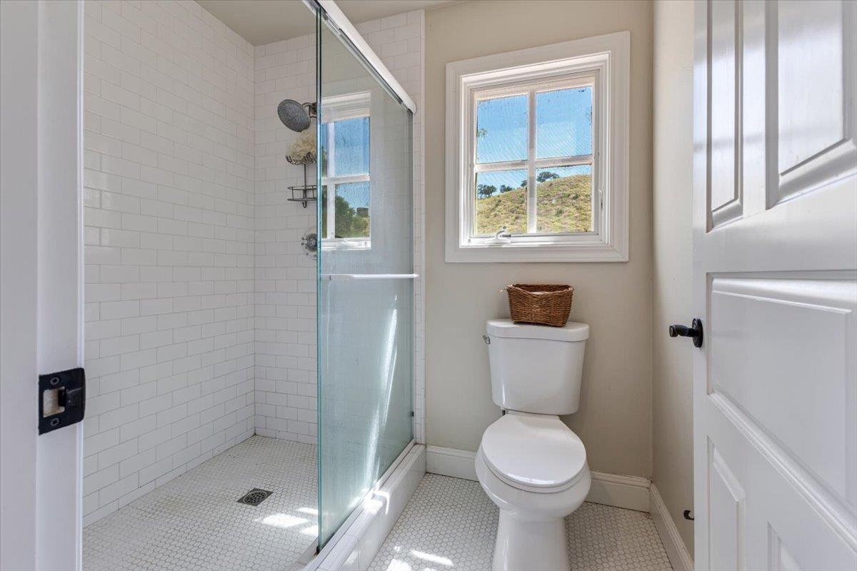 2727 Thomas Road Hollister, CA 95023 - Photo 31 of 83 a white toilet sitting in a bathroom next to a window