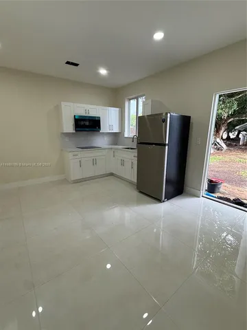 a view of kitchen and microwave