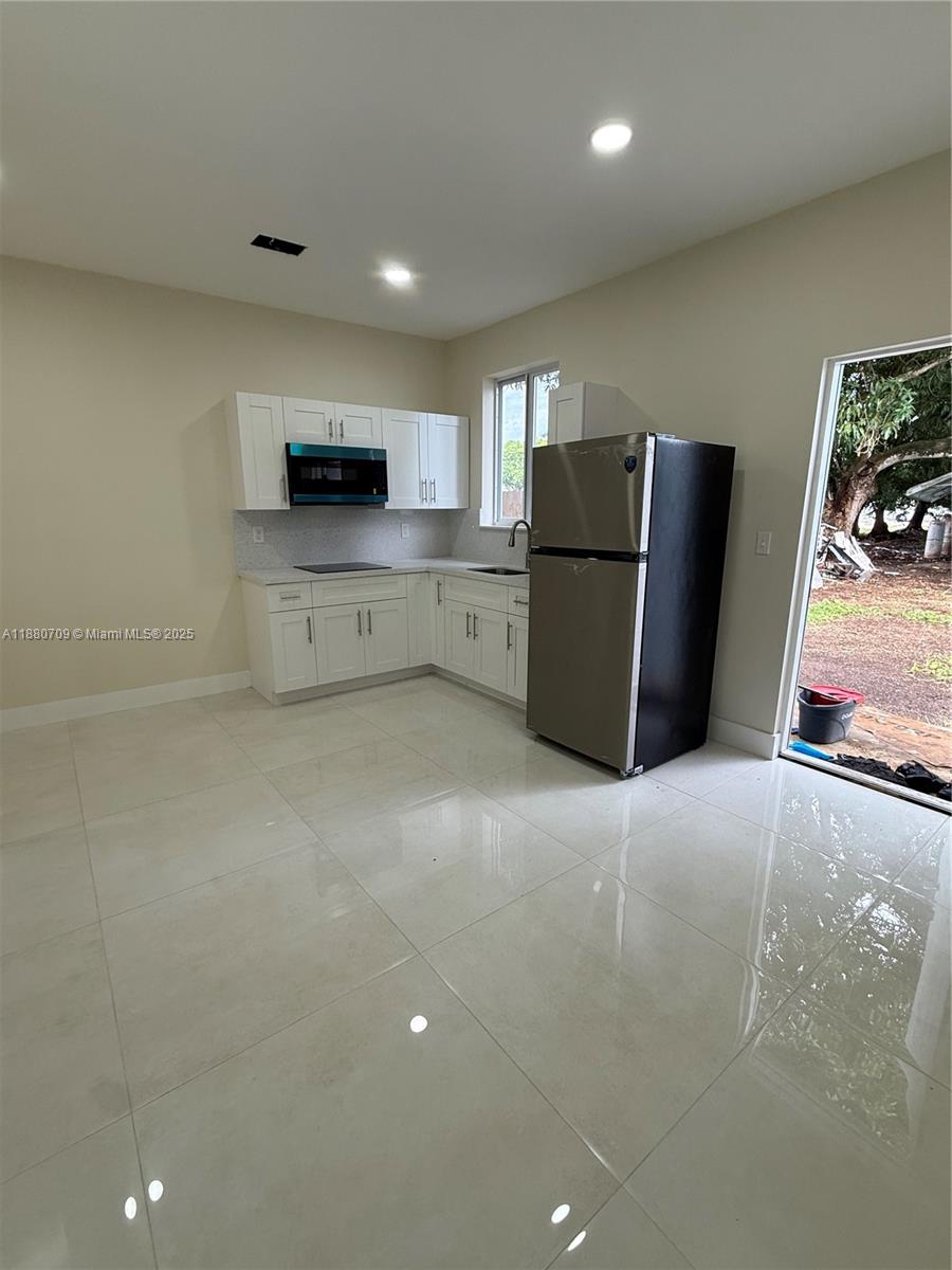 a view of kitchen and microwave