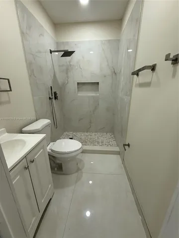 a bathroom with a sink and toilet
