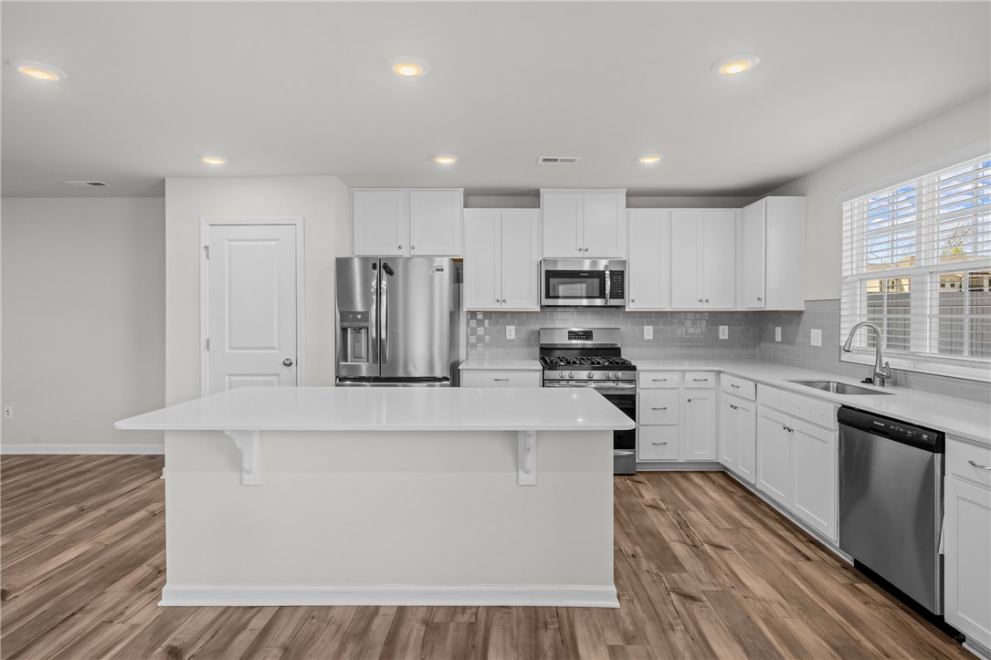516 Brasstown Court Pendleton, SC 29670 - Photo 12 of 23 This bright kitchen features modern appliances and ample counter space for culinary pursuits.