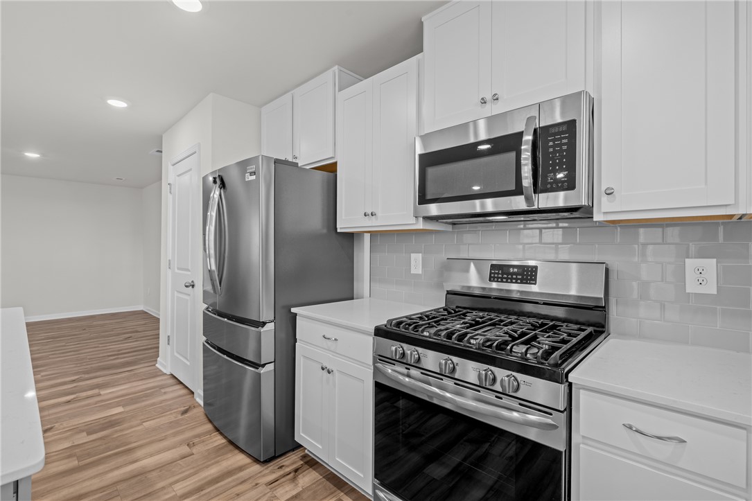 516 Brasstown Court Pendleton, SC 29670 - Photo 13 of 23 This modern kitchen features stainless steel appliances and ample cabinetry.