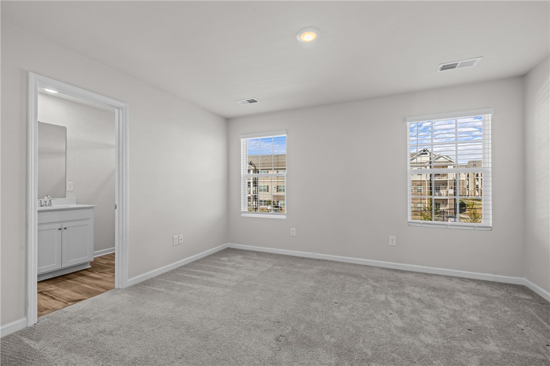 516 Brasstown Court Pendleton, SC 29670 - Photo 16 of 22 Primary bedroom with and ensuite and plenty of natural light.