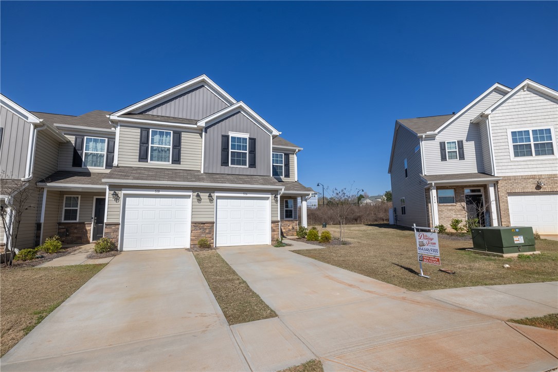 516 Brasstown Court Pendleton, SC 29670 - Photo 6 of 23 This newly constructed property features a clean facade and spacious driveway.