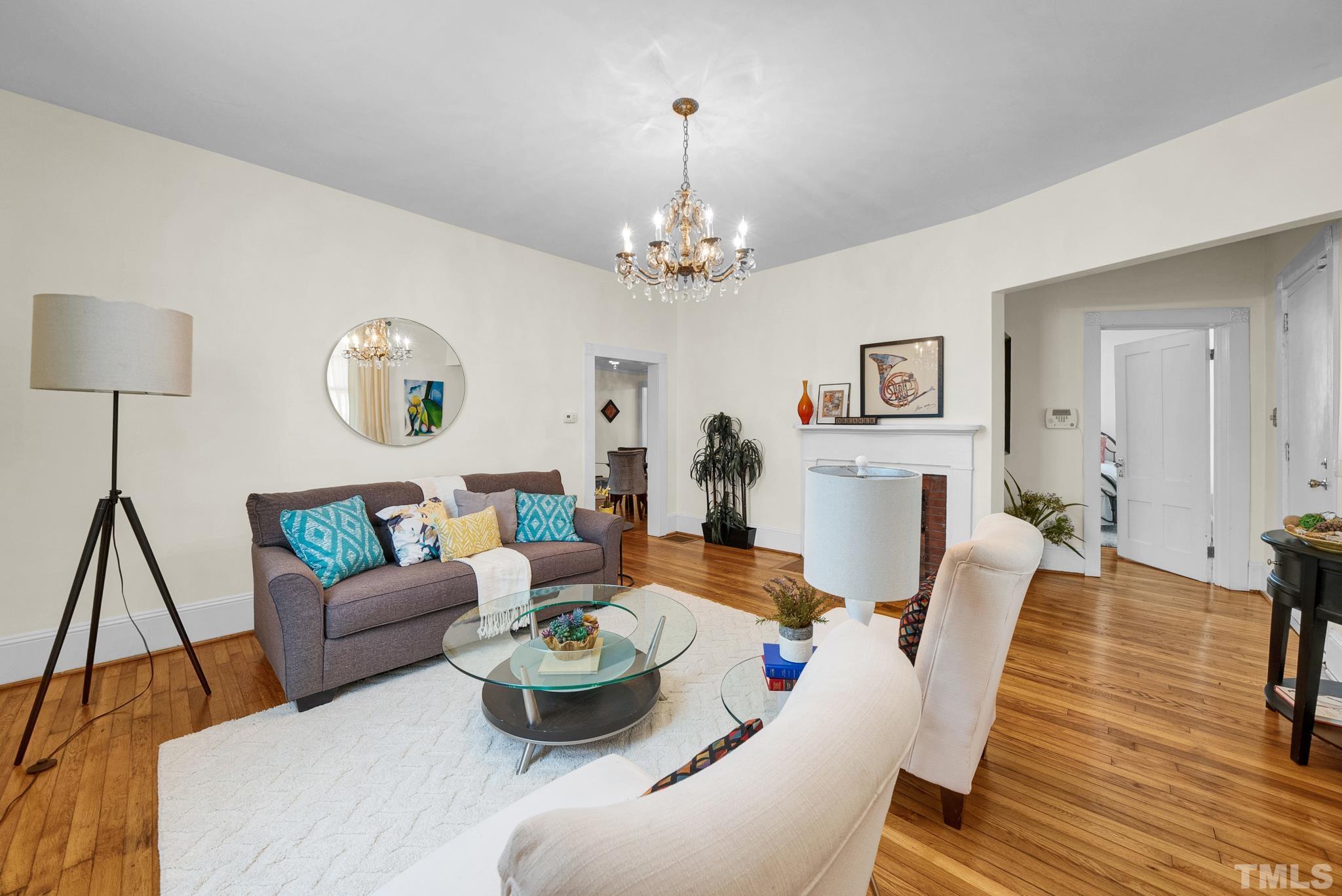 545 East Jones Street Raleigh, NC 27601 - Photo 12 of 35 a living room with furniture and a wooden floor