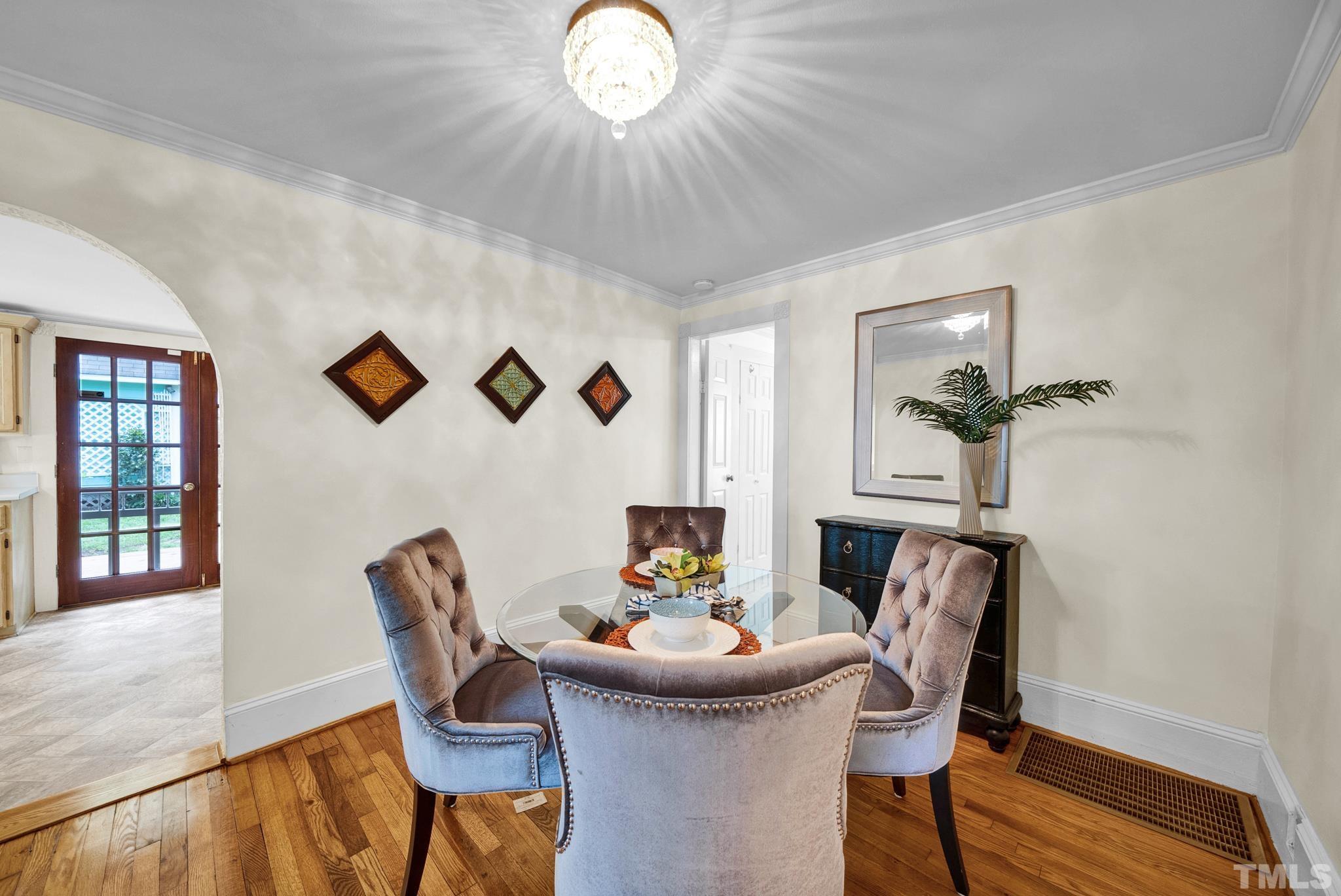545 East Jones Street Raleigh, NC 27601 - Photo 14 of 35 a view of a dining room with furniture and wooden floor