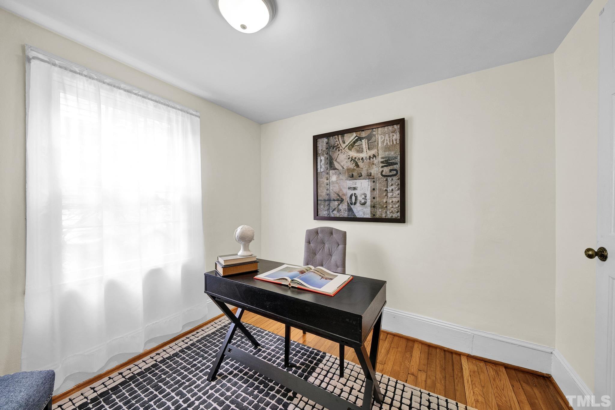545 East Jones Street Raleigh, NC 27601 - Photo 31 of 35 a view of a workspace with furniture and a window