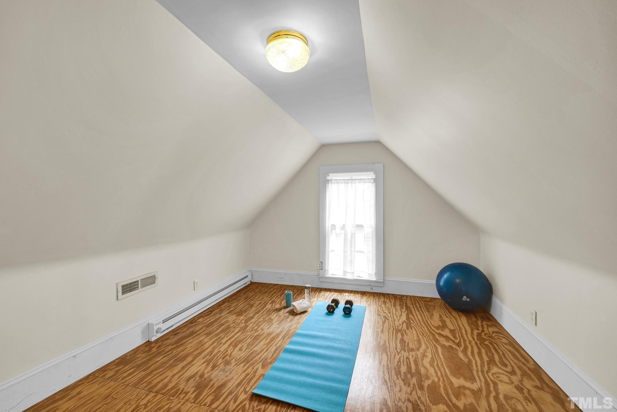 545 East Jones Street Raleigh, NC 27601 - Photo 33 of 35 a bedroom with a bed and a window