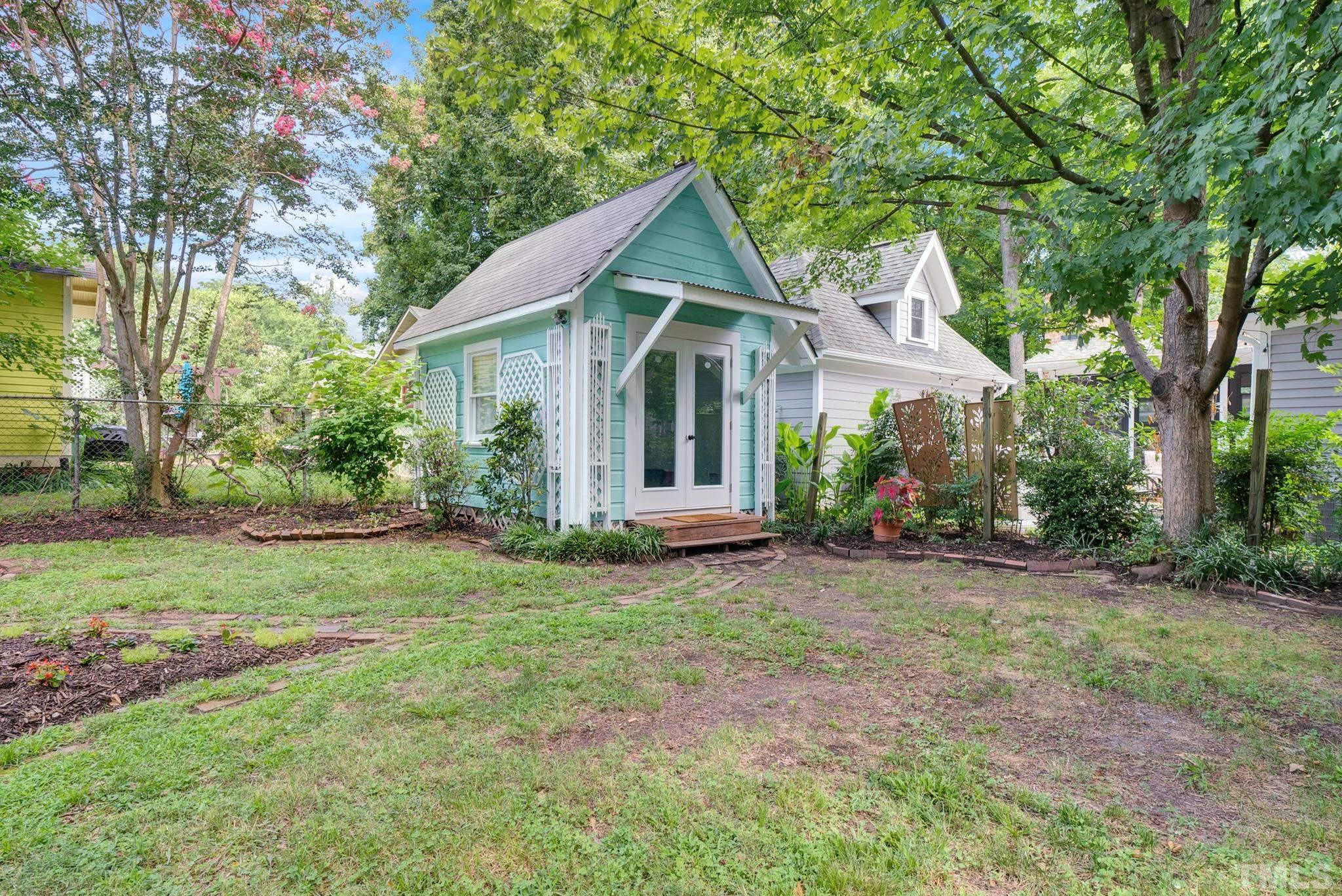 545 East Jones Street Raleigh, NC 27601 - Photo 8 of 35 a view of a house with yard and a garden