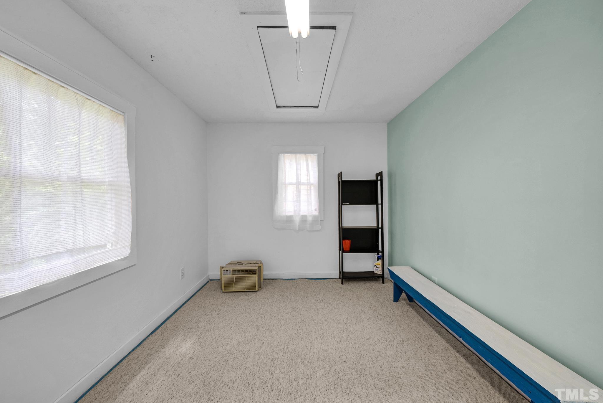 545 East Jones Street Raleigh, NC 27601 - Photo 9 of 35 wooden floor in an empty room with a window